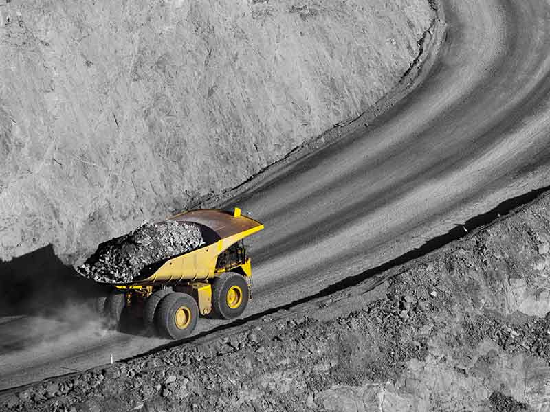 mining earth mover on road